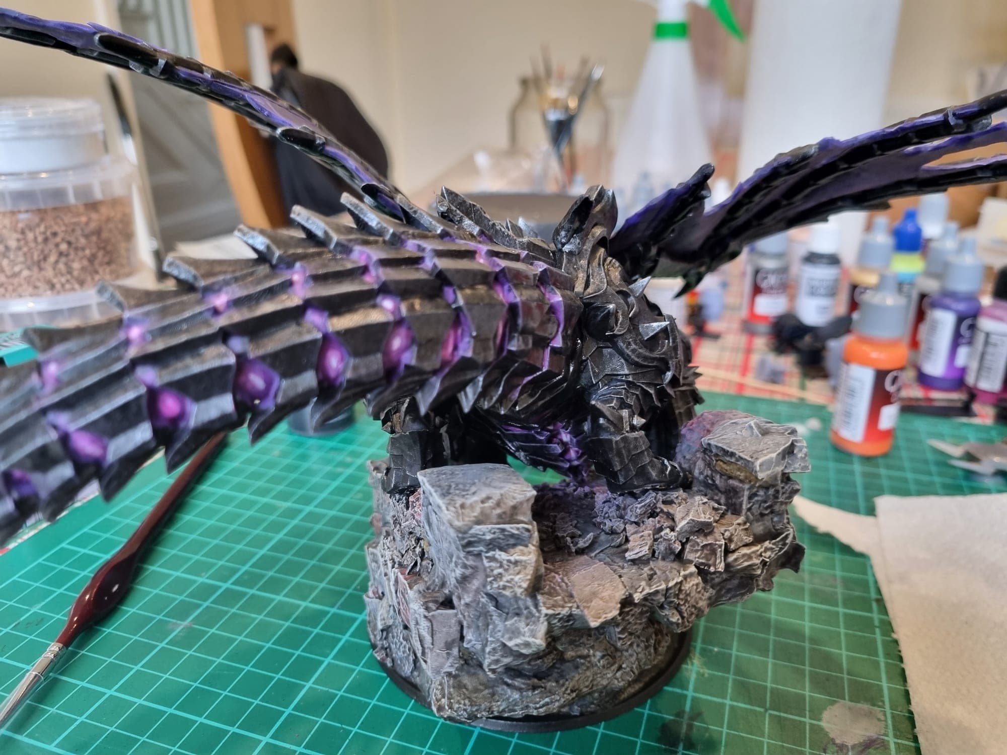 The dragon's tail and base detail from the side.