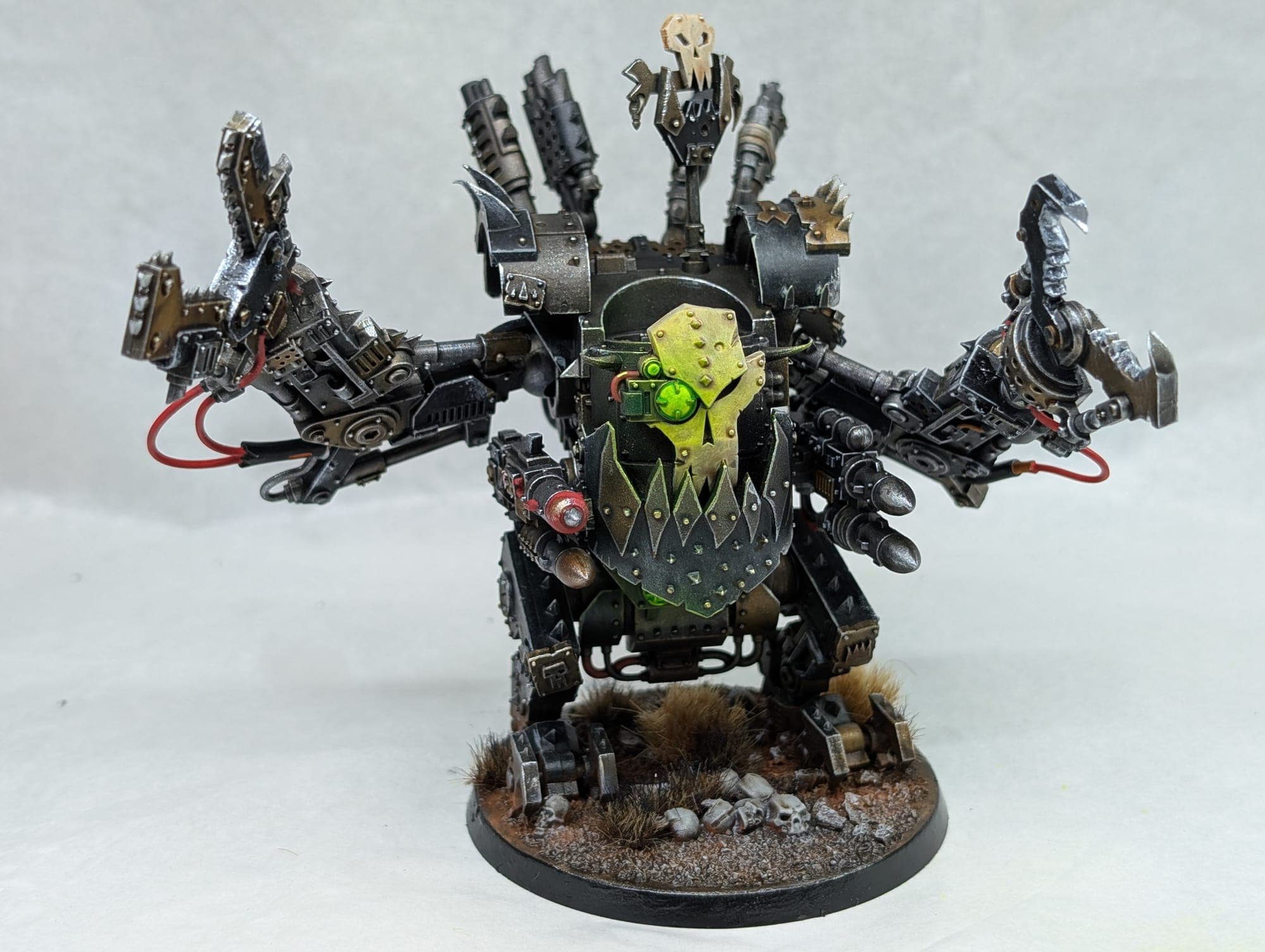 Ork Deff Dread, front on with a glowing green eye.