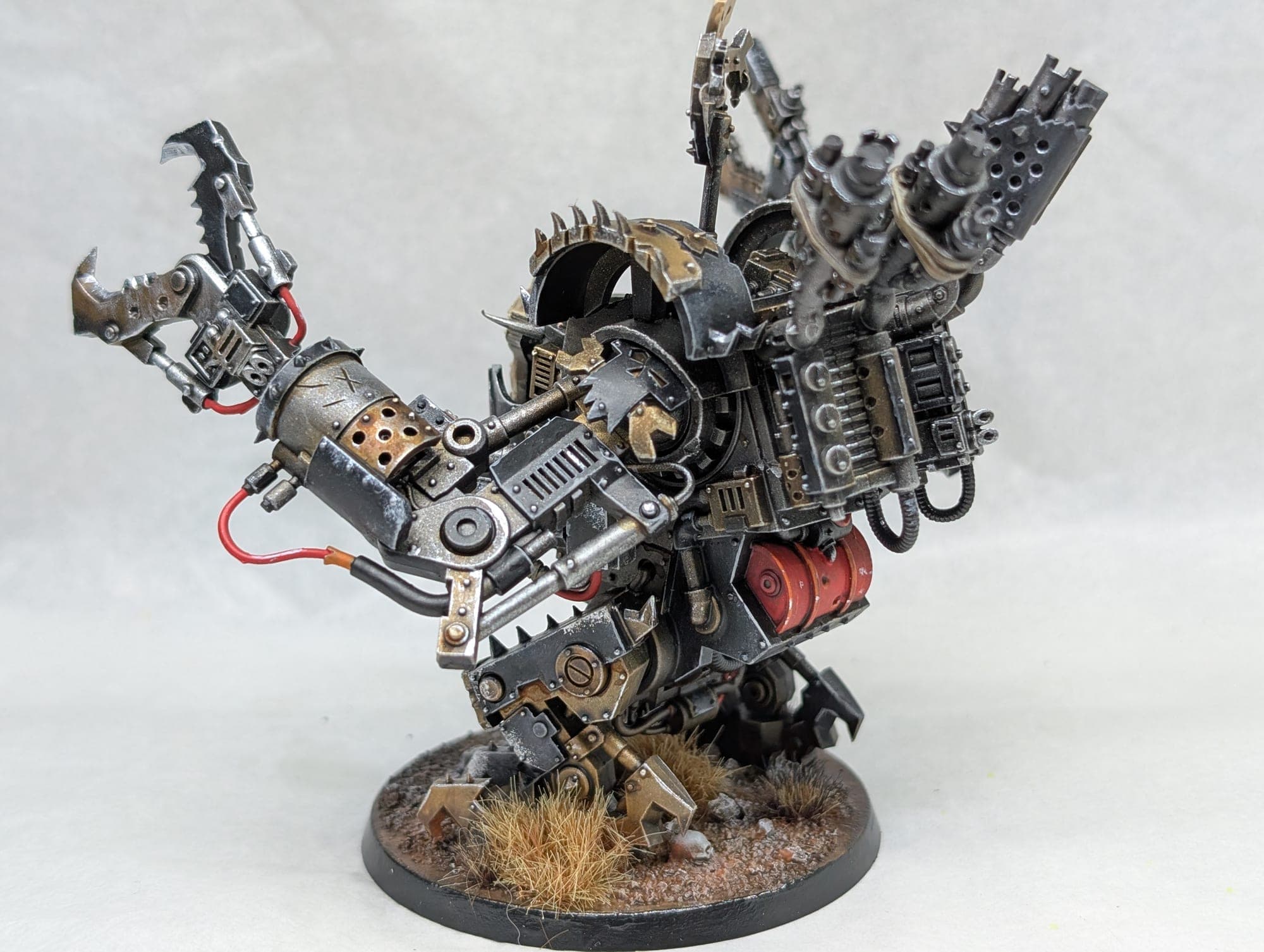 The same Ork walker at three-quarters, weathered metal and red detail.
