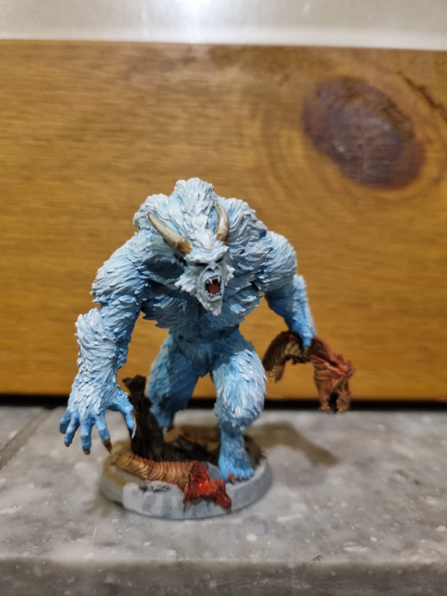 Pale blue yeti model mid-kill.